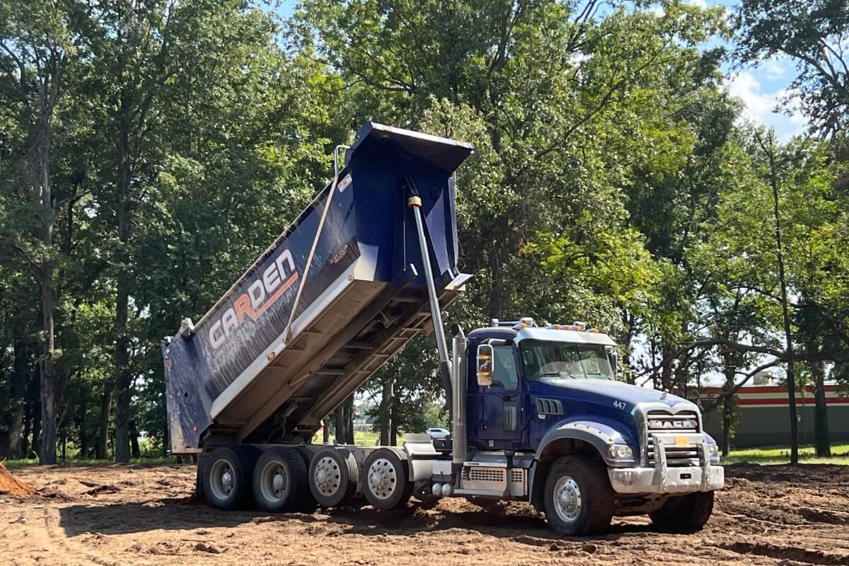 Quad axle dump truck on highway